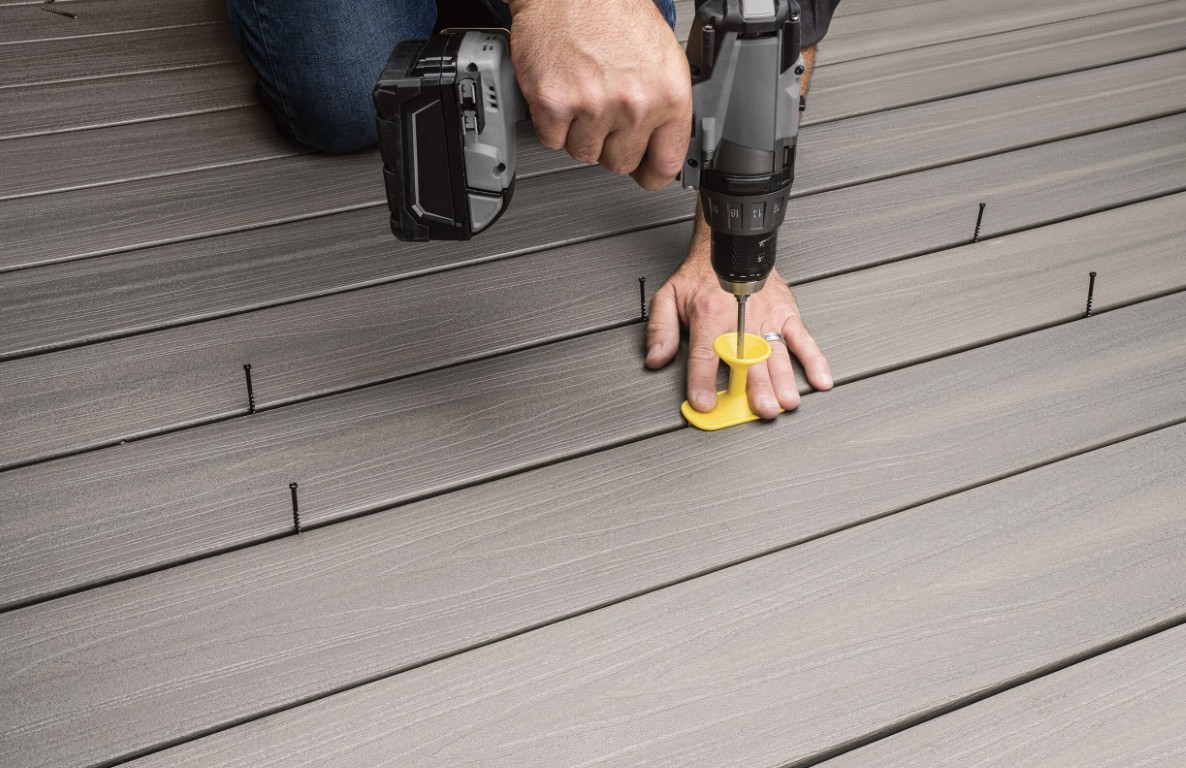 Professional deck builder installing composite decking in Poinciana, FL